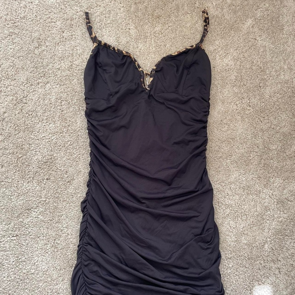 Tiger Mist ruched black mini dress with leopard trim on the straps and charm
